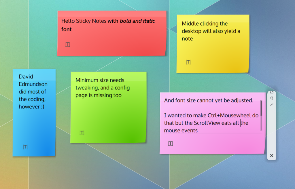 Various sticky notes of different color placed on the desktop